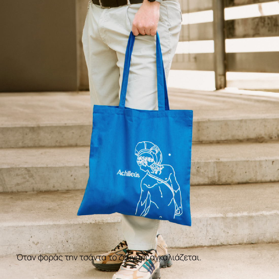 Model wearing Blue Tote Bag Achilleus and Patroklos street style look
